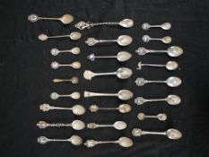 Assorted 20th century silver and white metal collectors, mostly with enamel finials together with