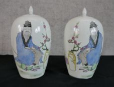 Two Japanese jars, decorated with a portrait of a man next to the branches of a cherry tree and