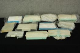 A well preserved collection of lace material. Age unknown but marked 'Made in England' mostly