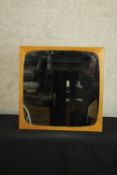 A mid 20th century teak framed square wall mirror. H.54 W.54cm.