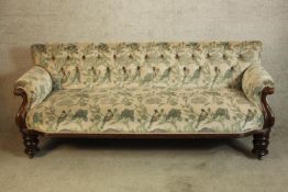 A Victorian mahogany framed deep button back upholstered settee. H.80 W.190 D.70cm.