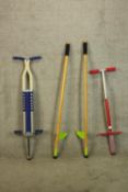 Two Pogo sticks and a pair of stilts. The largest of the three measures 120 cm.