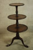 A George III mahogany three tier dumb waiter. H.114 Dia.58cm.