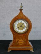 An Edwardian inlaid mahogany mantle clock, the enamelled dial with black Roman and Arabic numerals