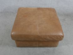 A contemporary square brown leather footstool H.39 W.76 D.76cm