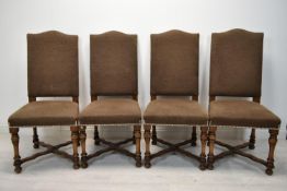A set of four upholstered Continental style dining chairs.