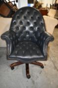 Desk chair, leather upholstered swivel action. H.112 cm.