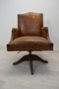 Captain's desk chair, leather upholstered swivel and tilt action. H.103 cm.