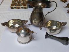 A collection of silver, including a desk seal a pair of salts in the forms of quaighs, a milk jug an