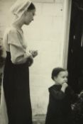 A framed photograph, a governess and child. The photographer has captured a compassionate moment.