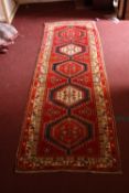 A Kazak runner. L.330 W.103cm.