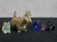An early 20th century Zsolnay le Pecs painted porcelain Scotty dog together with four other dog