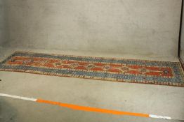 A Shirvan runner. L.336 W.91cm.