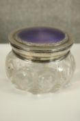 A cut glass pot with silver rim and enamelled lid. Hallmarked with lion and anchor. H.8 Dia.12cm.