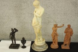 Five reproduction ancient Greek or Roman statues. The largest of the five, Venus, is made from