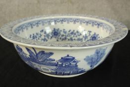 A blue and white decorated ceramic basin. Probably late Victorian. With a light chip in the rim.