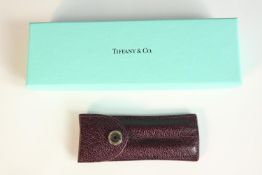 A Tiffany and Co blue lacquered body with intricate silver design purse pen with sleeve cover and