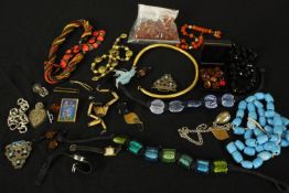 A collection of costume jewellery, including Murano glass foil beads, a filigree wirework heart