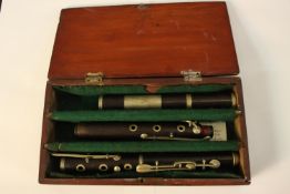 A hardwood cased 19th century cocuswood and nickel flute, Nach Meyer. H.16 W.30cm.