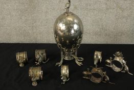 Australia themed silver plated napkin rings and an egg poacher decorated with kangaroos etc. H.25cm.
