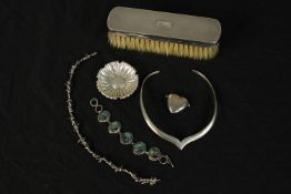 A collection of silver and jewellery, including a modern silver collar, a relief daisy design dish