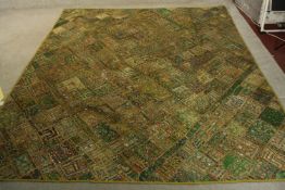 A very large green Indian sequin embellished wall hanging with abstract design. L.250 W.204cm.