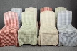 Eight Georgian style chairs upholstered in red leather and covered in pastel shaded of blues, green,
