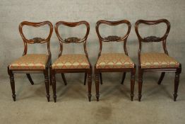 Dining chairs, a set of four mid 19th century rosewood with newly covered drop in seats.
