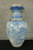A large blue hand painted vase decorated with Chinese pagoda and gilt edging. H.50cm.