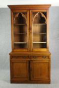 Library bookcase, late 19th century oak Gothic style, in two sections. H.244 W.130cm.