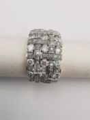A diamond and 14 carat white and yellow gold dress ring. Set with fifteen round brilliant cut