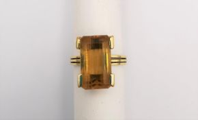 An 18ct yellow gold Citrine cocktail ring. Set with a rectangular mixed cut Citrine with an