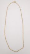 A Theo Fennell 18ct yellow gold diamond spectacle chain. The chain is studded with eight round