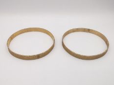 Two 9ct yellow gold bark texture wide bangles. Stamped 9ct. Weight 24g. D.6CM