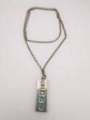 A Sterling silver ingot and chain. Hallmarked for London 1977. Weight of 43g. L.35 cm