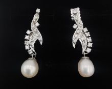 A pair of vintage white metal (tests as 18 carat white gold) diamond and fresh water pearl foliate