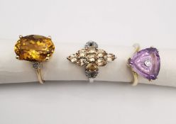Three 20th century 9 carat gold gem-set rings, a amethyst and diamond trillion solitaire ring, a