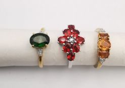 Three 20th century 9 carat gold gem-set rings with certificates. A Tulelei and white zircon three