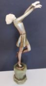 After Josef Lorenzl (Austrian, 1892-1950), an Art Deco painted bronze and ivory sculpture of