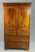 Linen press, early 19th century flame mahogany, in two sections. H.202 W.117 D.58cm.