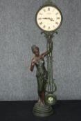 A contemporary Juliana quartz pendulum figural table clock in a bronzed finish. 71 cm.