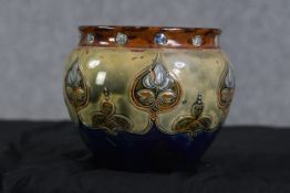 A Royal Doulton jardiniere, Art Nouveau design. Early twentieth century. H.17 W.21 D.21 cm