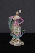 Staffordshire style porcelain figure. Twentieth century. H.24 W.11 D.11 cm.