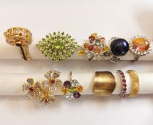 A collection of ten silver and gold plated silver dress rings some set with gemstones, including