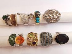 A collection of ten silver and gold plated silver dress rings set with various gemstones,