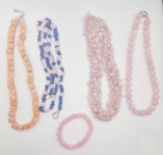 Four gemstone necklaces and a bracelet, including a blue stone and rose quartz bead necklace, a rose