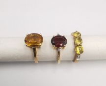 Three 20th century 9 carat gold gem-set rings, with certificates: a Orissa sphene and diamond