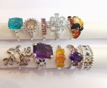 A collection of ten silver and gold plated silver dress rings some set with gemstones, including