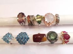 A collection of ten silver and gold plated silver dress rings set with various gemstones,