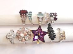 A collection of ten silver and gold plated silver dress rings set with various gemstones,
